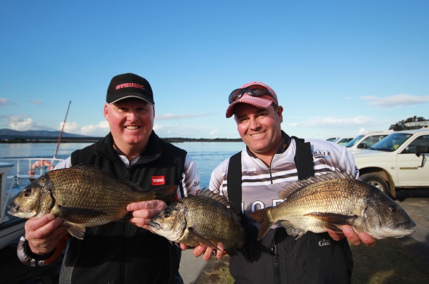 Fisho's Scott Thomas filming Bushy talking about Squidgy's new prawn lures.